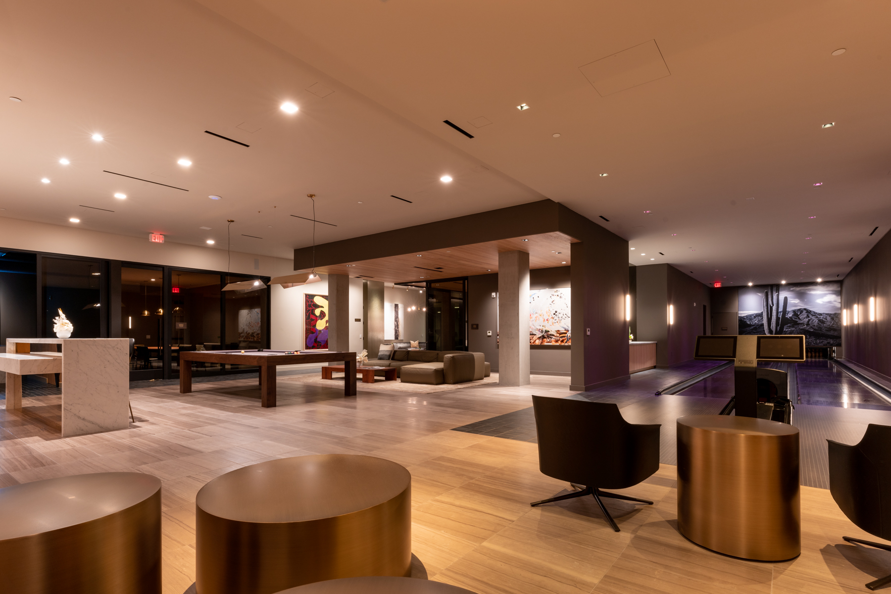 Shared residential lounge with billiards and flexible seating.
