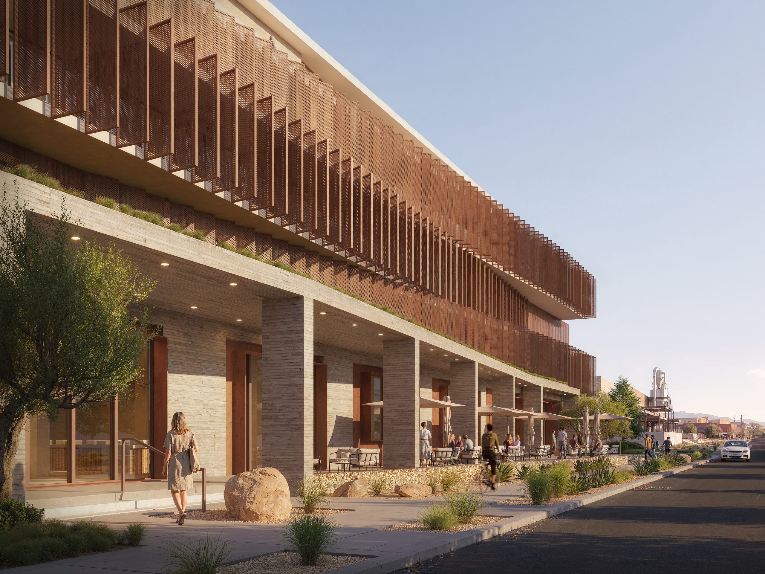 Street-level rendering of the Sawmill Hotel by OFFICEUNTITLED featuring a layered perforated metal façade, shaded outdoor walkways, and climate-responsive hospitality design in Albuquerque, New Mexico.