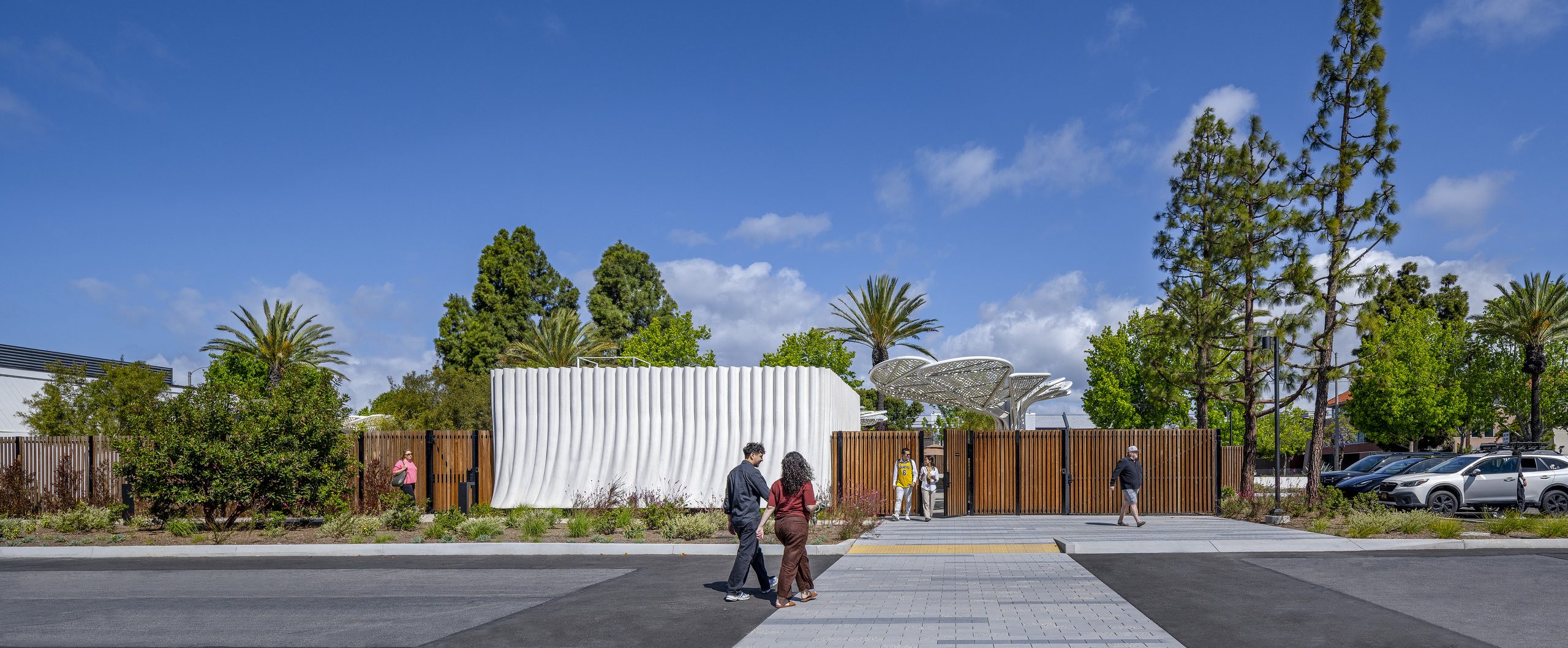 Street view of SNAP Campus Park showing the landscaped entrance, amenity building, and entry plaza.