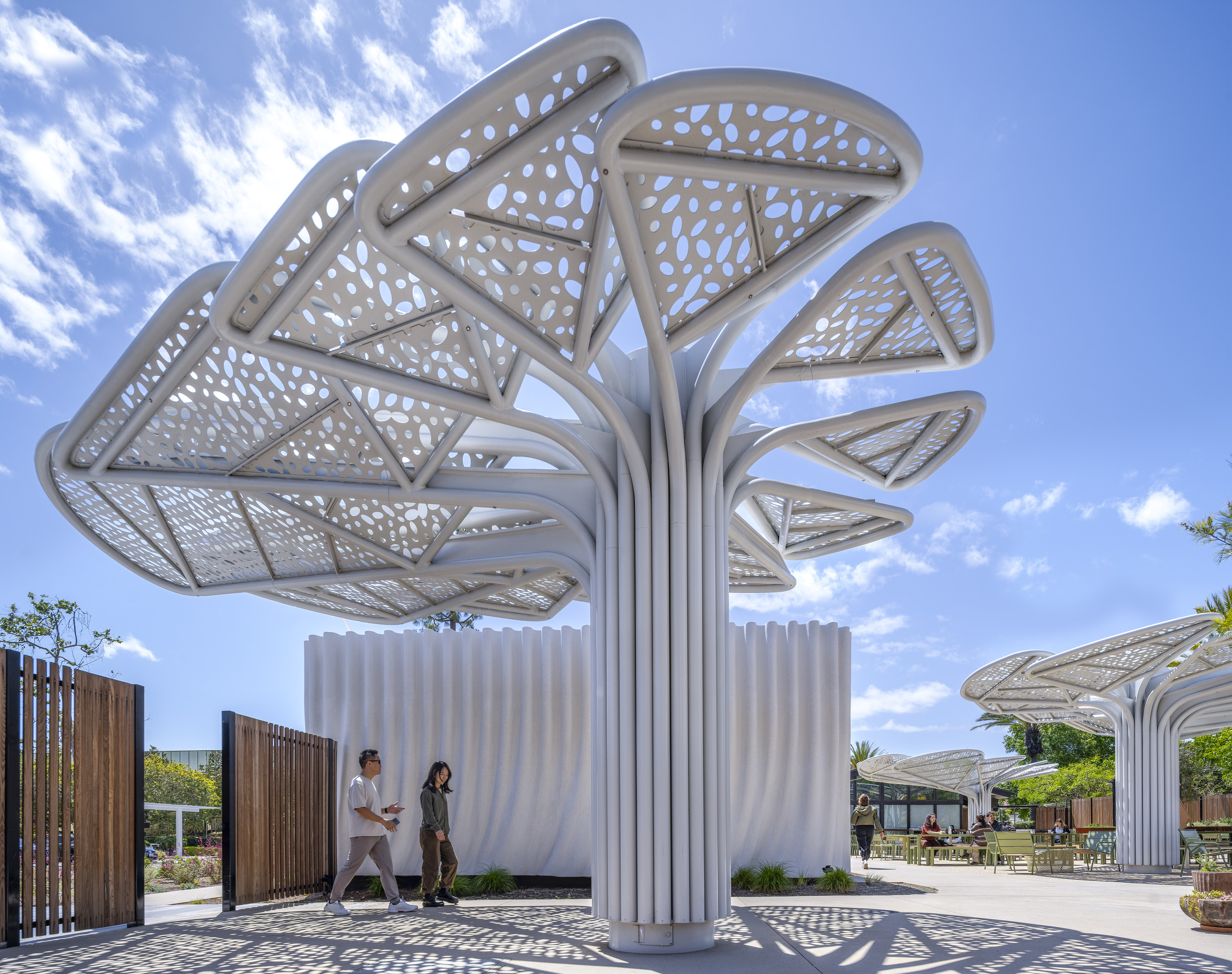 Custom shade canopy at SNAP Campus Park creating a shaded outdoor gathering space at the campus entrance.
