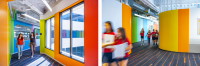 Two-image collage of teachers and students walking through colorful hallways at Village School in Santa Monica.Two-image collage of teachers and students walking through colorful hallways at Village School in Santa Monica.