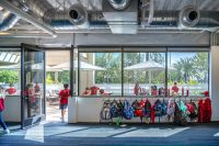 Students eating outdoors on a sunlit terrace at Village School in Santa Monica.